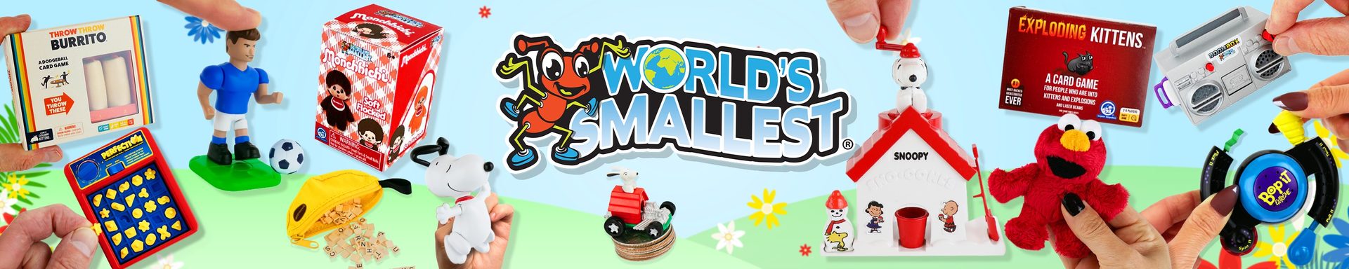 Hands holding World's Smallest miniature toys and games